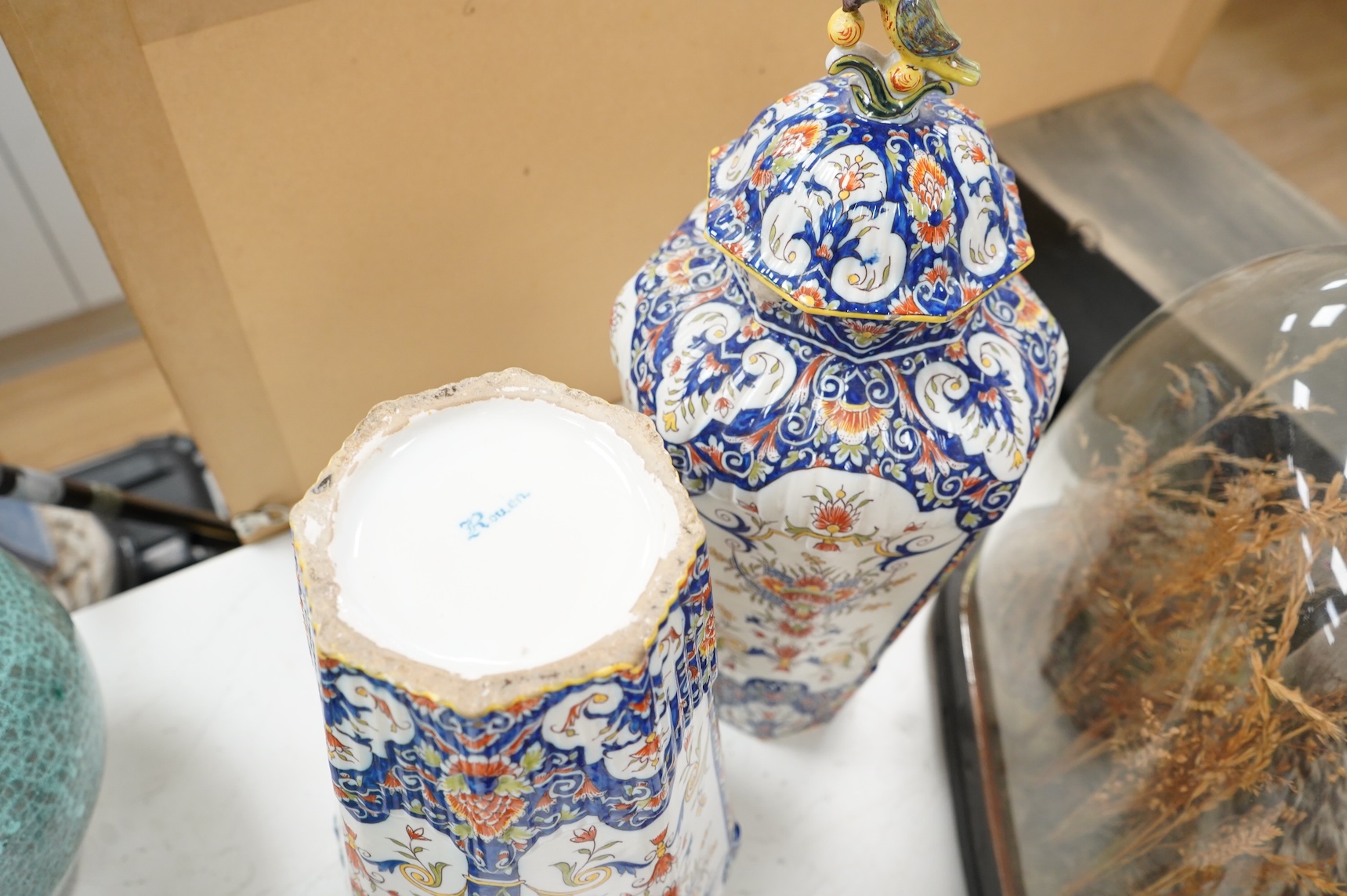 A pair of early 20th century Rouen faience vases and covers, the knops in the form of birds, 49cm high